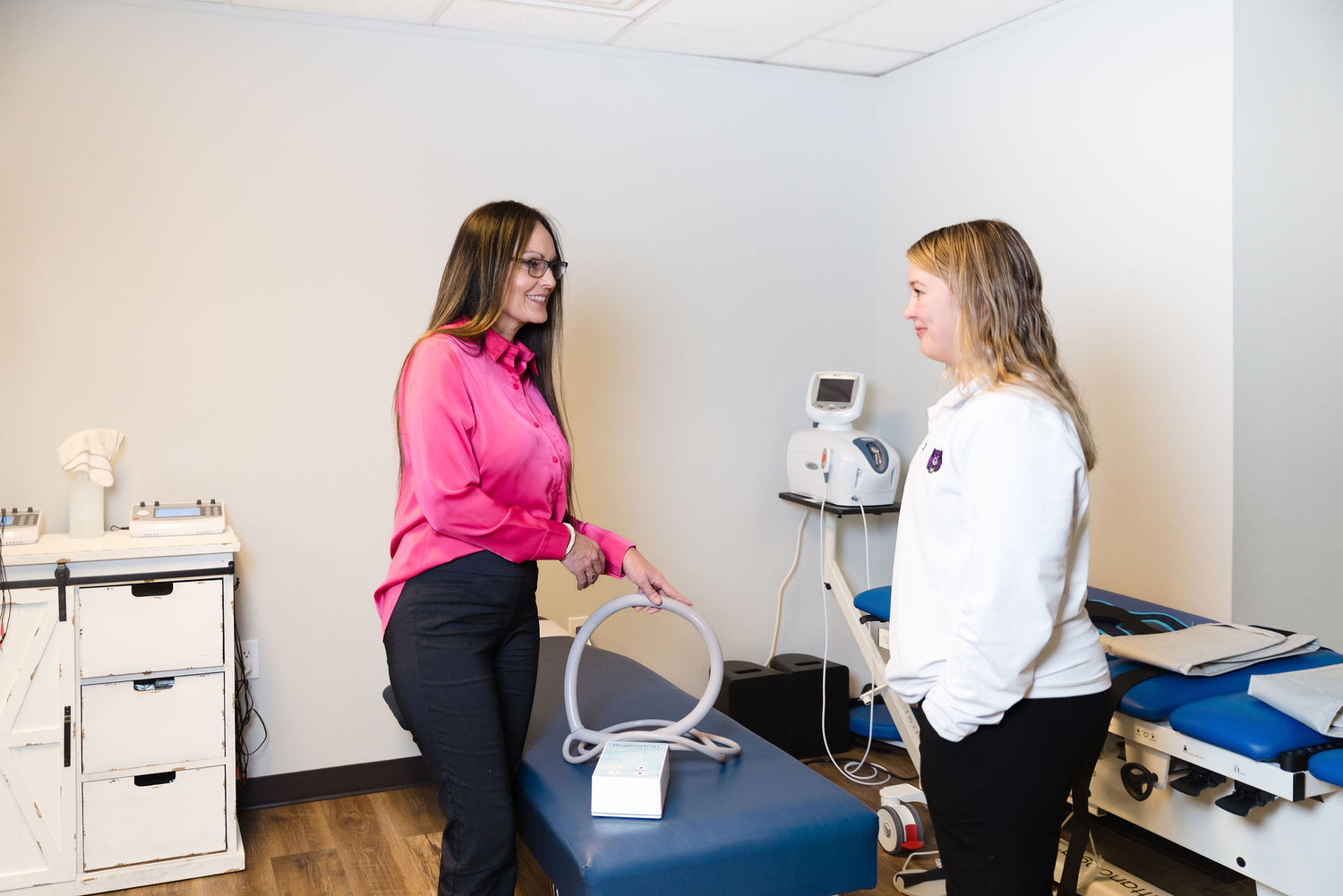 Stephanie training a healthcare provider in a clinic